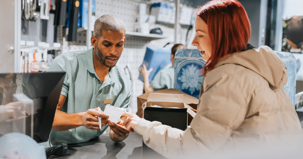 Employee and customer struggling with in-store return